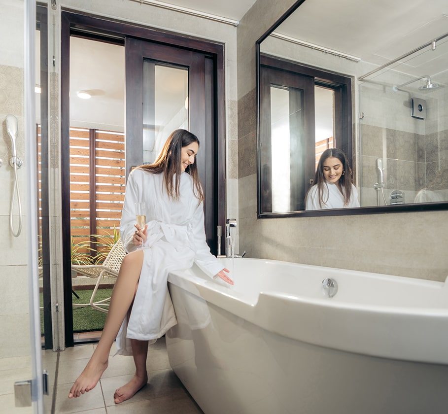 Luxurious Embassy Grove bathroom with modern fittings, standalone tub, and ambient lighting.