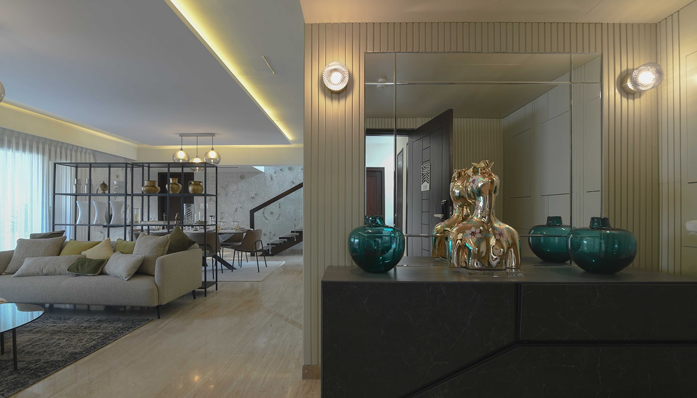 Elegant Embassy Grove living and dining area featuring modern décor, ambient lighting, designer furnishings, and a luxurious open layout in a premium Bangalore villament